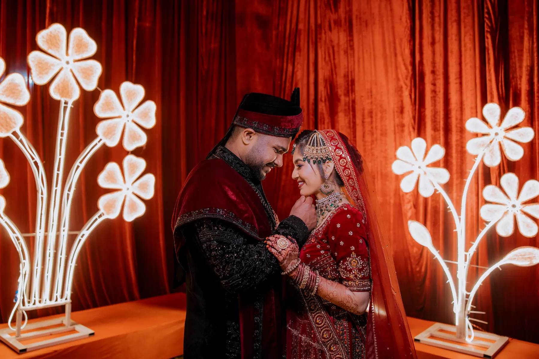 Aamir & Binish in a red wedding portrait