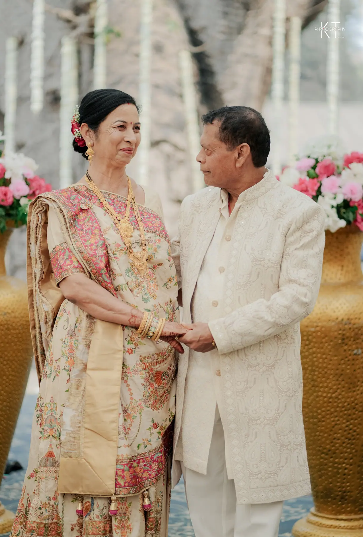 Sunil & Vaishnavi standing together in wedding attire