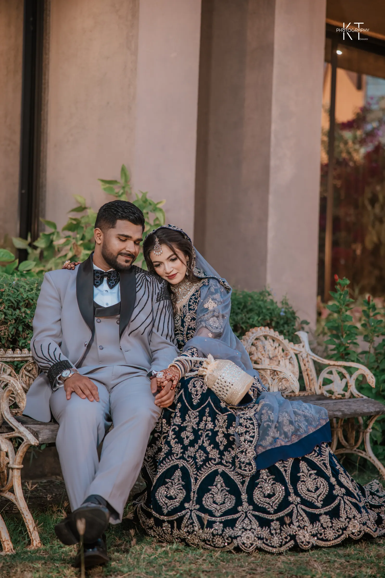 A couple seated together in an evening portrait